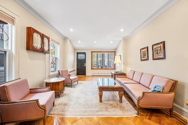 living room featuring a baseboard heating unit, ornamental molding, baseboards, and recessed lighting