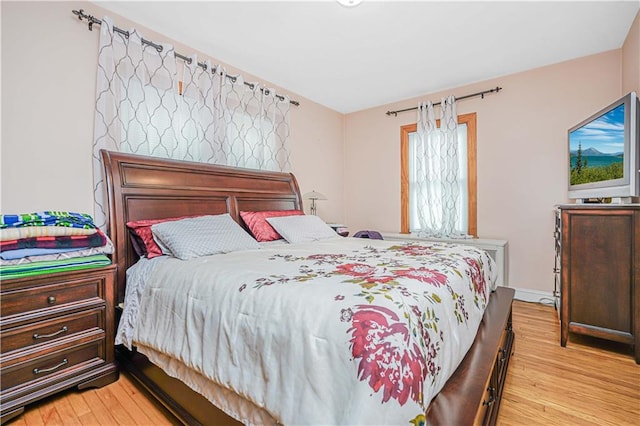bedroom featuring light wood-style flooring