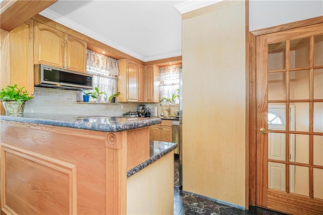 kitchen with stainless steel microwave, tasteful backsplash, ornamental molding, and dark stone countertops