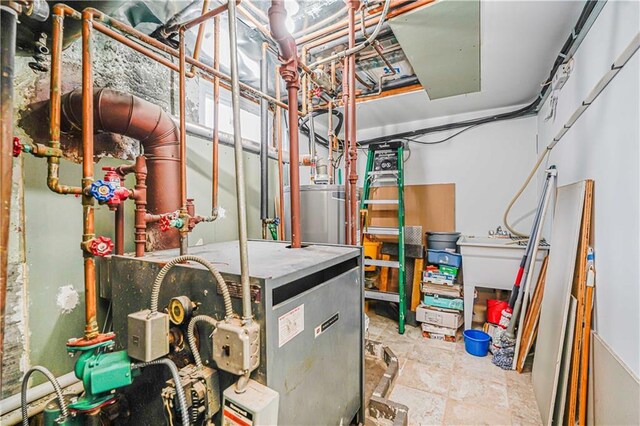 utility room featuring water heater