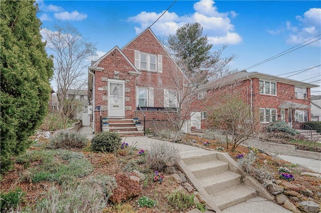 view of front of home featuring brick siding