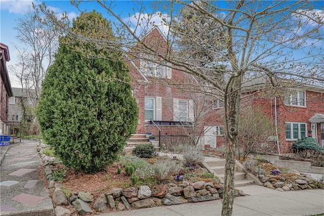 view of home's exterior featuring brick siding