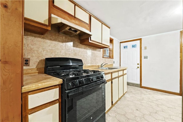 2554 W 16th St, Brooklyn, NY 11214 - kitchen with black gas stove, backsplash, light countertops, and under cabinet range hood