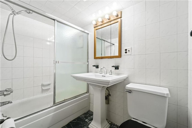 2554 W 16th St, Brooklyn, NY 11214 - bathroom featuring enclosed tub / shower combo, marble finish floors, and tile walls