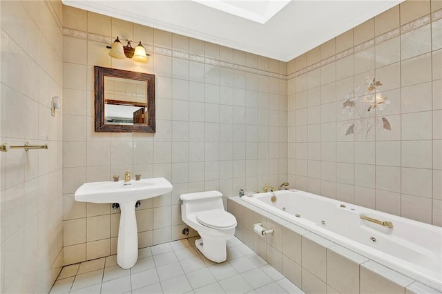 full bath with tile walls, a jetted tub, toilet, tile patterned flooring, and crown molding