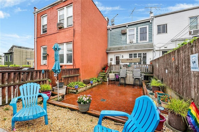 651 20th St, Brooklyn, NY 11218 - back of property with a deck and cooling unit