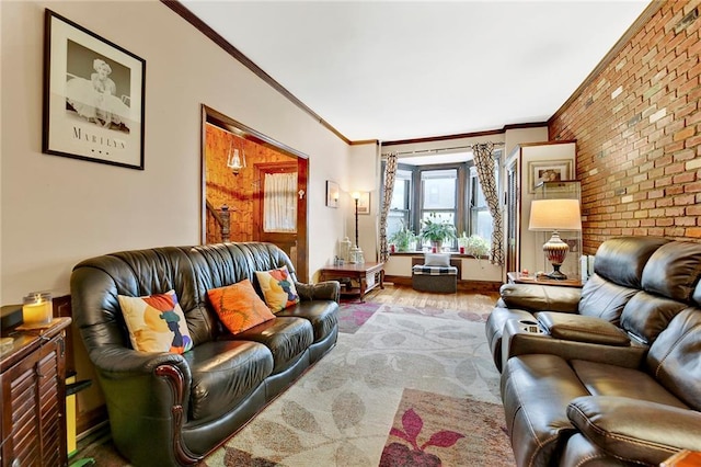 living room featuring crown molding, wood finished floors, and brick wall