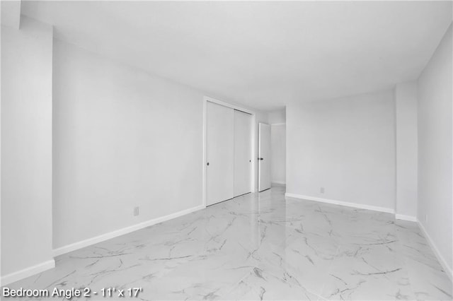 35 Seacoast Ter Unit 16D, Brooklyn, NY 11235 - spare room featuring marble look tiles and baseboards