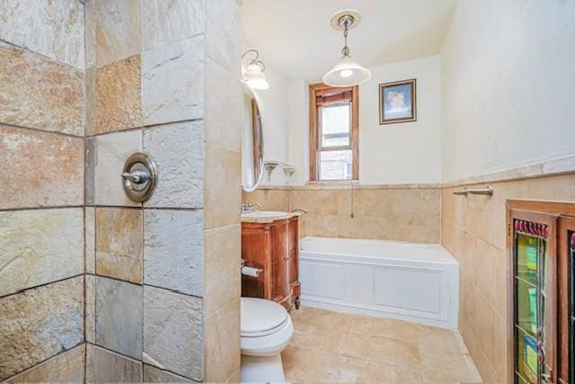bathroom featuring a garden tub, vanity, toilet, tiled shower, and tile walls