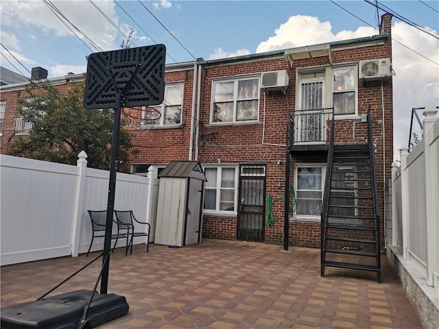 view of patio / terrace featuring a wall mounted air conditioner