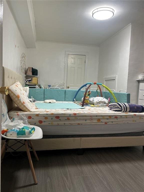 bedroom with wood finished floors