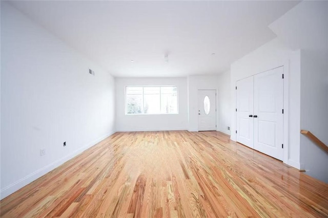 146 Beach St, Staten Island, NY 10304 - unfurnished living room featuring light wood-style floors and baseboards