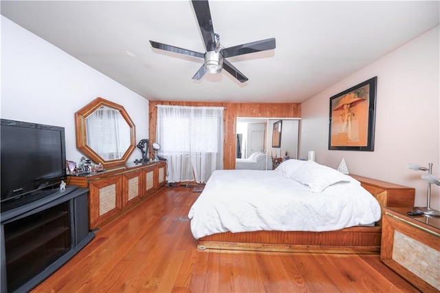 bedroom with wood finished floors and a ceiling fan