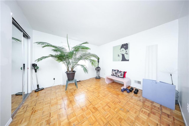 unfurnished room with visible vents