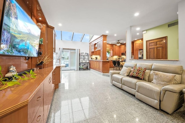 living area with granite finish floor, visible vents, ceiling fan, and recessed lighting