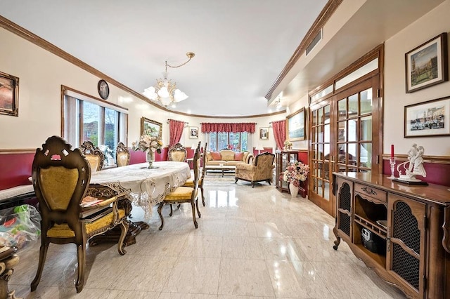dining space featuring a chandelier, visible vents, crown molding, and french doors