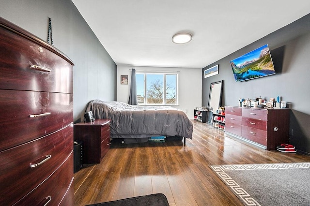 bedroom featuring dark wood-style floors