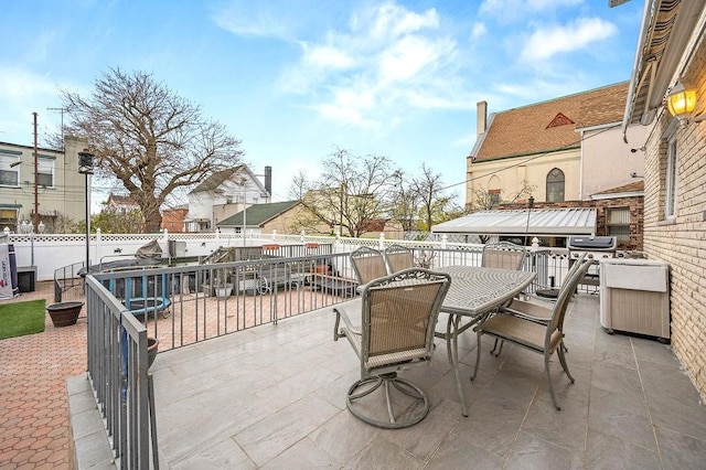 view of patio / terrace with a fenced backyard and outdoor dining area