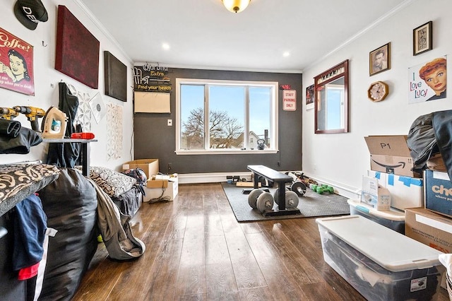interior space with wood-type flooring, baseboards, ornamental molding, and recessed lighting