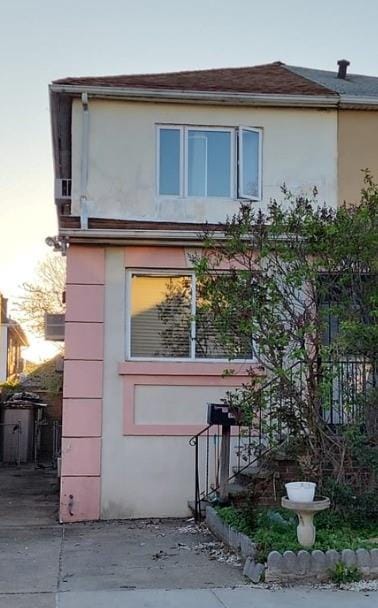 view of side of home featuring stucco siding