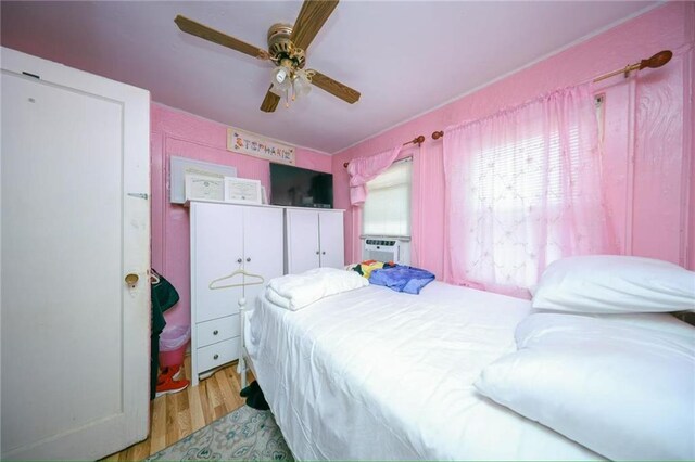 2939 Brighton 3rd St, Brooklyn, NY 11235 - bedroom with light wood-style flooring and ceiling fan
