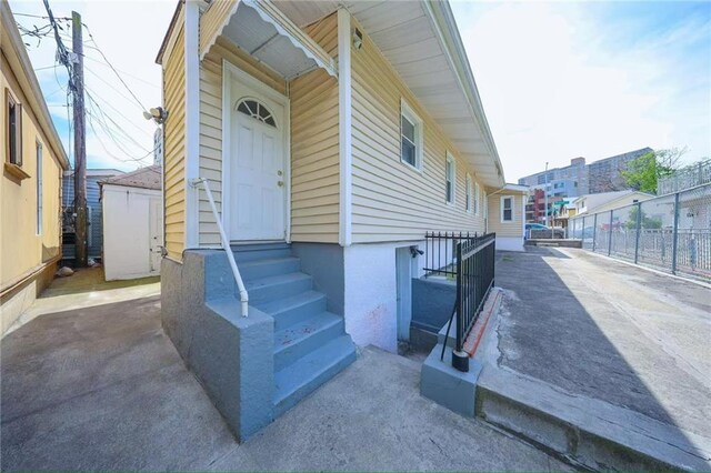 2939 Brighton 3rd St, Brooklyn, NY 11235 - doorway to property featuring fence and driveway