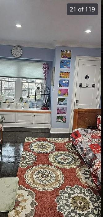 bedroom featuring crown molding, wood finished floors, and recessed lighting
