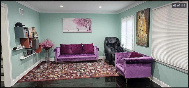 sitting room featuring crown molding, baseboards, wood finished floors, and recessed lighting