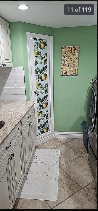 interior space with cabinet space, baseboards, and recessed lighting