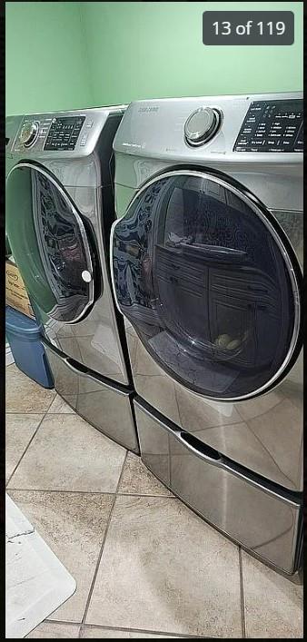 washroom featuring washer and clothes dryer