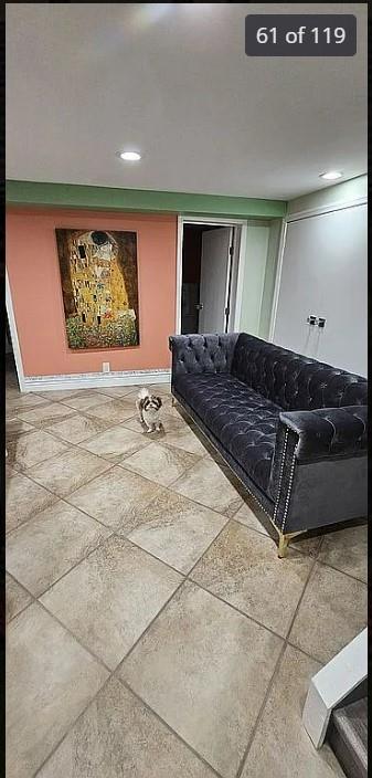 living area with recessed lighting and baseboards