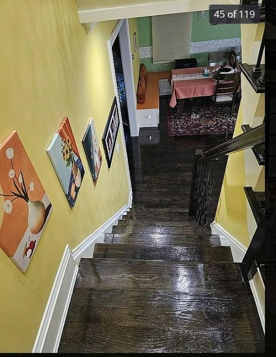 staircase featuring wood finished floors