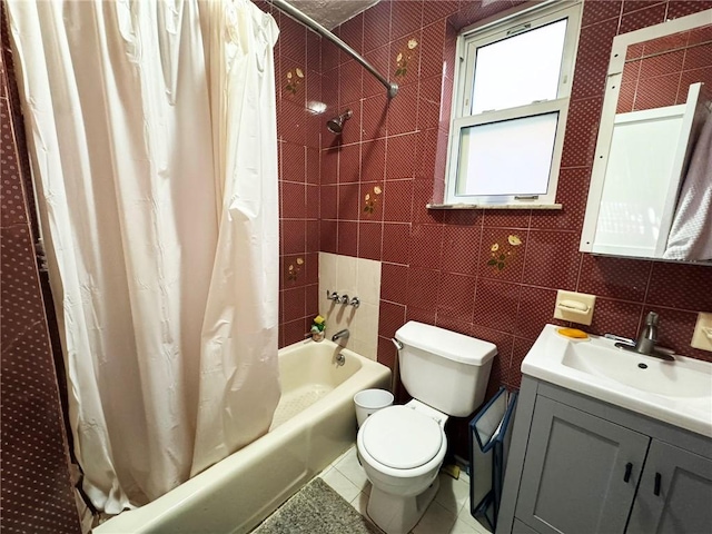 2518 W 1st St, Brooklyn, NY 11223 - full bath featuring toilet, vanity, shower / bathtub combination with curtain, and tile walls