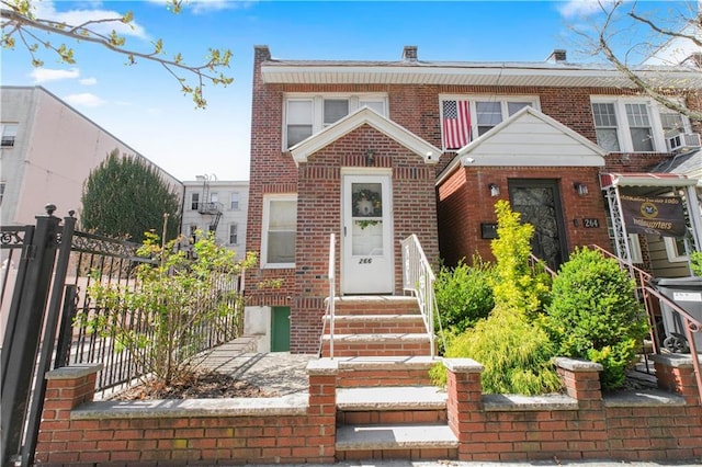 266 Wakeman Pl, Brooklyn, NY 11220 - view of property with brick siding, cooling unit, and fence