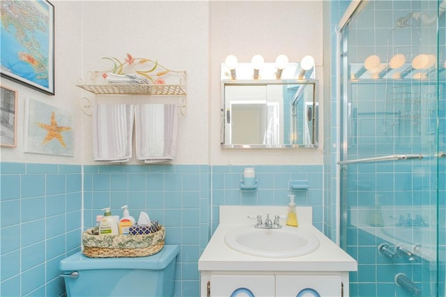 266 Wakeman Pl, Brooklyn, NY 11220 - bathroom with tile walls, vanity, toilet, and tiled shower