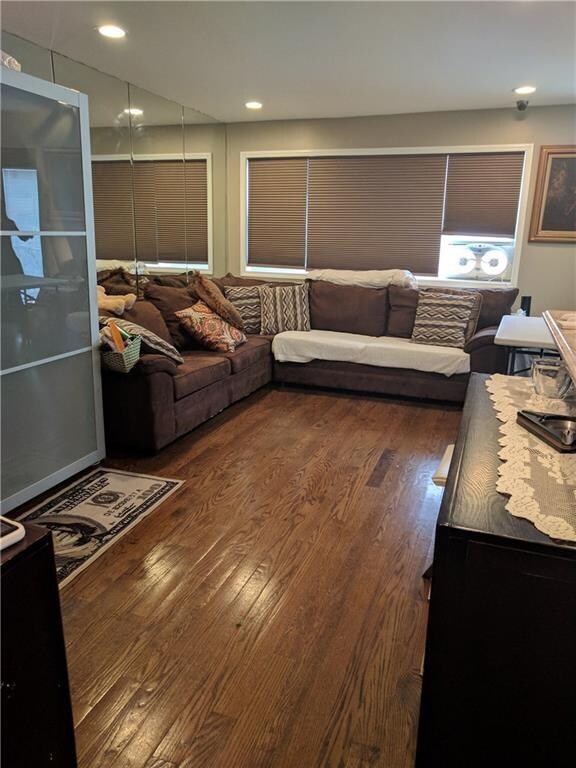 living area with wood finished floors