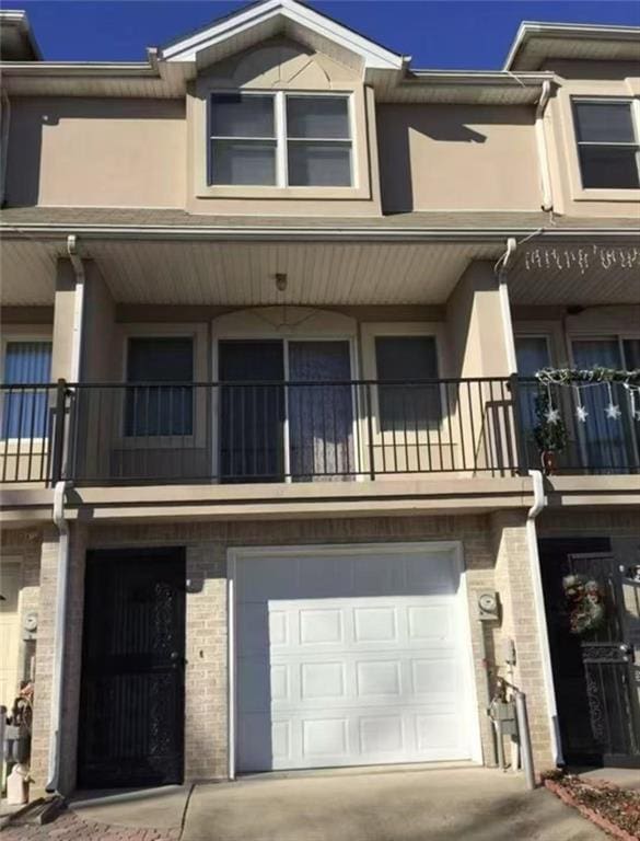 51 Crestwater Ct, Staten Island, NY 10305 - view of property featuring a garage and concrete driveway
