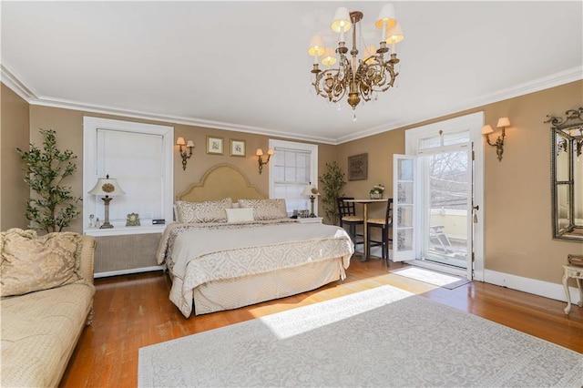 bedroom with crown molding, access to outside, a notable chandelier, and wood finished floors