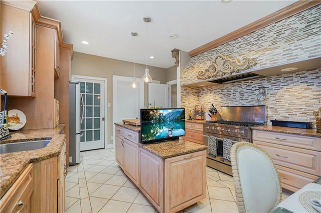 kitchen featuring appliances with stainless steel finishes, light brown cabinets, a center island, light tile patterned floors, and tasteful backsplash
