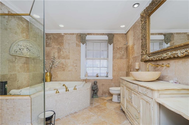 bathroom with vanity, toilet, tile walls, ornamental molding, and a bath