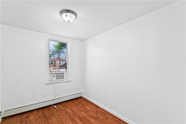 1462 E 92nd St, Brooklyn, NY 11236 - spare room featuring a baseboard heating unit, wood finished floors, baseboards, and cooling unit