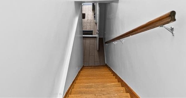 1462 E 92nd St, Brooklyn, NY 11236 - staircase with baseboards and wood finished floors