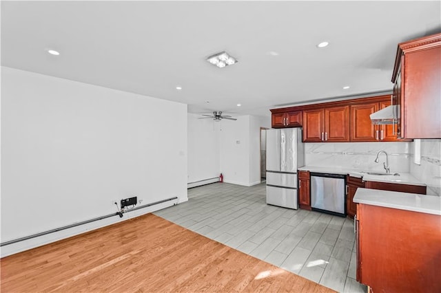 1462 E 92nd St, Brooklyn, NY 11236 - kitchen with stainless steel dishwasher, freestanding refrigerator, baseboard heating, a sink, and light countertops
