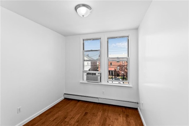 1462 E 92nd St, Brooklyn, NY 11236 - empty room featuring a baseboard heating unit, cooling unit, baseboards, and dark wood-style floors