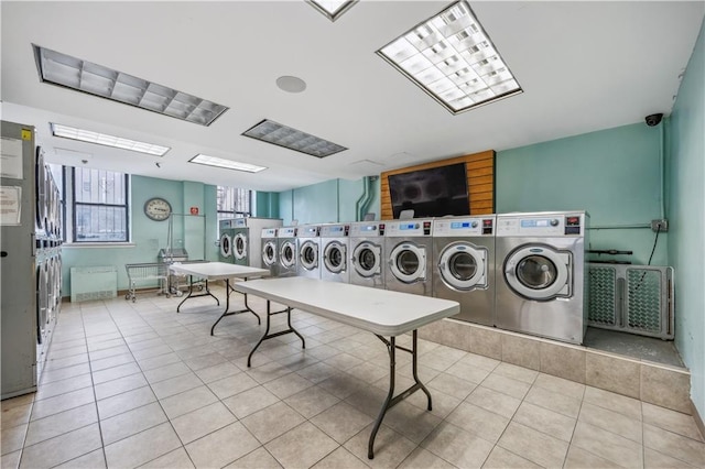 2800 Coyle St Unit 318, Brooklyn, NY 11235 - community laundry room with light tile patterned floors and washer and clothes dryer