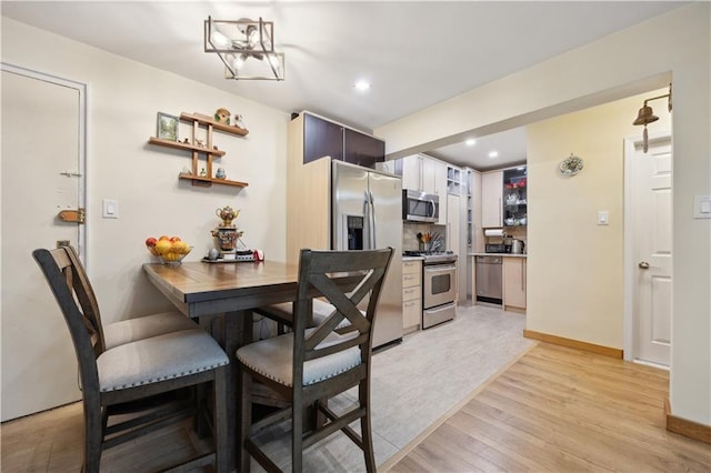 2800 Coyle St Unit 318, Brooklyn, NY 11235 - dining room featuring baseboards, recessed lighting, and light wood-style flooring