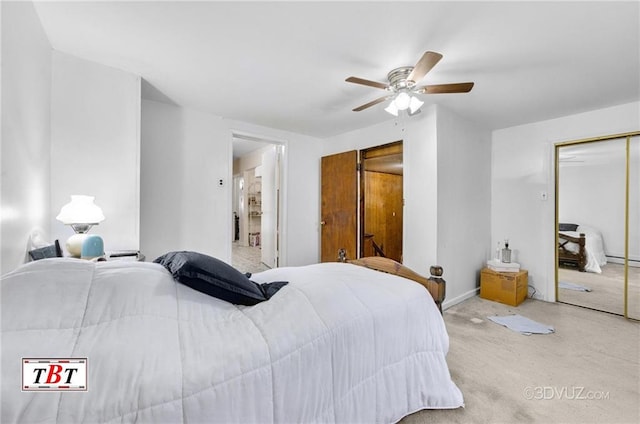 carpeted bedroom featuring a ceiling fan and a baseboard heating unit