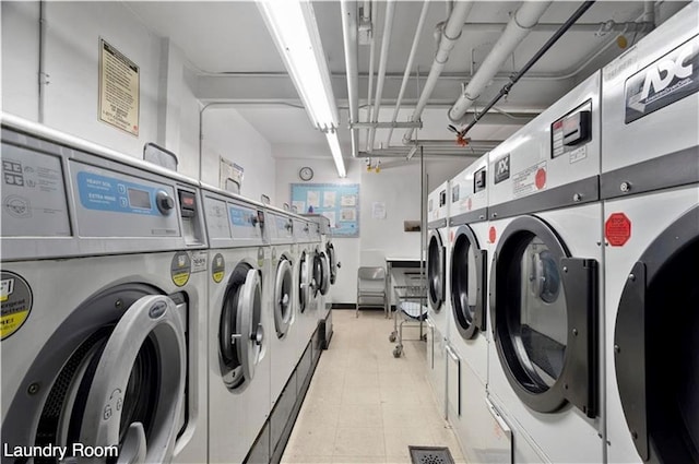 community laundry room featuring washing machine and clothes dryer