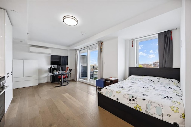 623 H Ave Unit 7C, New York, NY 11230 - bedroom with multiple windows, light wood-type flooring, a raised ceiling, and an office area