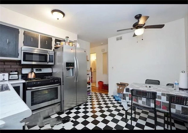 32 Dickie Ave, Staten Island, NY 10314 - kitchen featuring stainless steel appliances, light countertops, tile patterned floors, ceiling fan, and backsplash